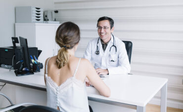 Male doctor with female patient
